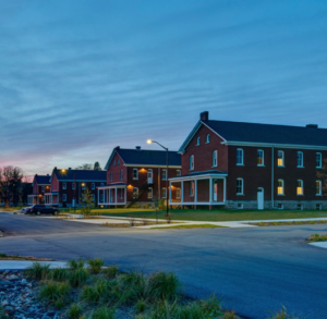 Wide view of Fort Des Moines buildings at twilight